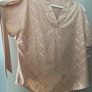 Summer cold shoulder blouse with ties on the sleeves.